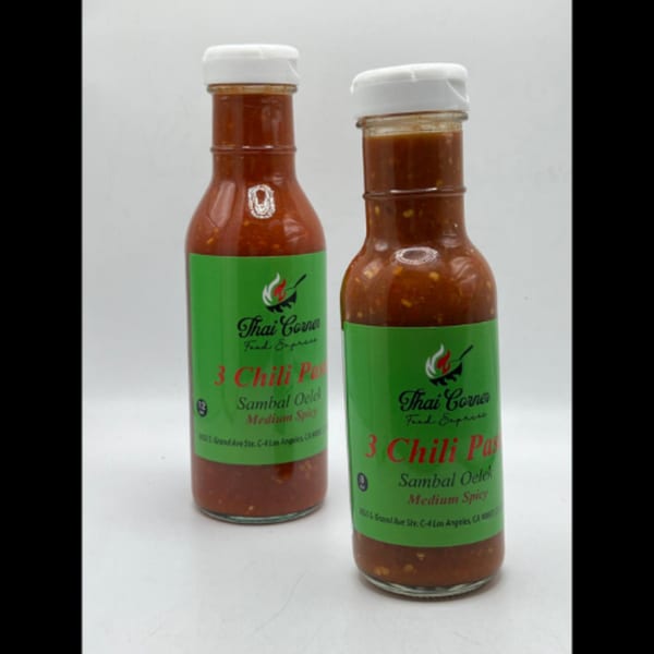 Two bottles of Thai Corner Food Express 3 Chili Paste Sambal Oelek, medium spicy, on a white background.