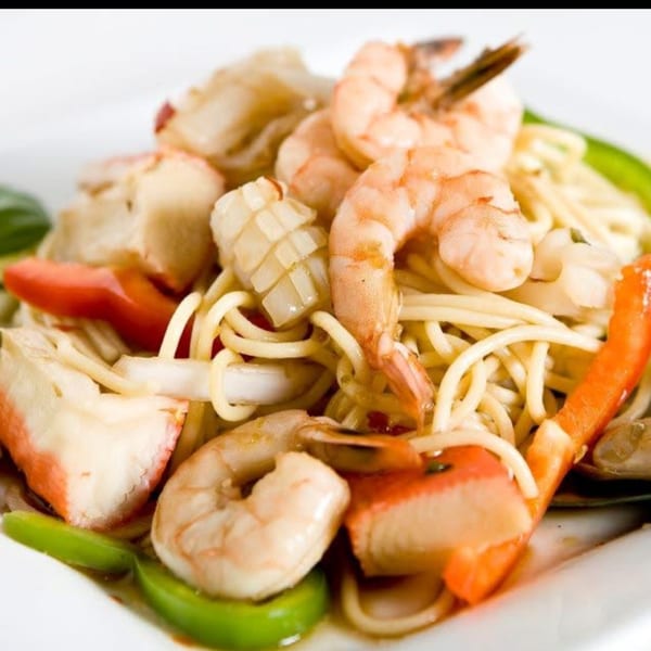 Thai Corner Food Express's seafood noodle dish with shrimp, squid, crab, and vegetables.